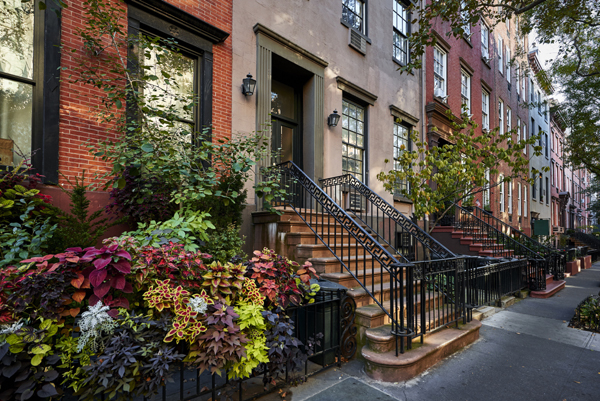a row of colorful brownstone buildings